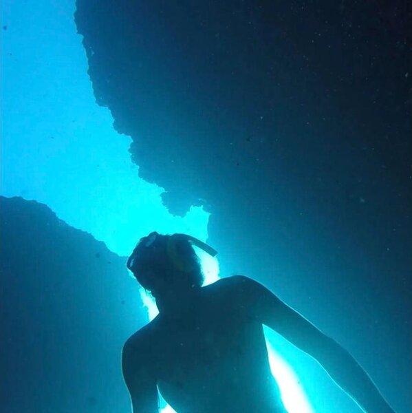 Elie Galabert underwater, lit from above